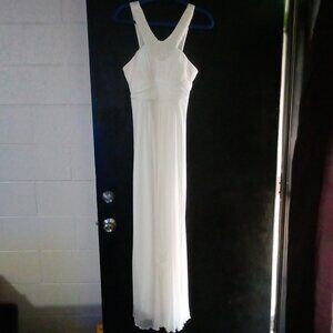 Beaded oval sleeveless white sheer flowing gown